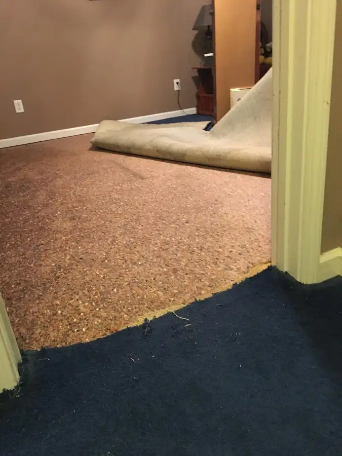 Carpet pad removal revealing water damage during Drying & Dehumidification in Kihei